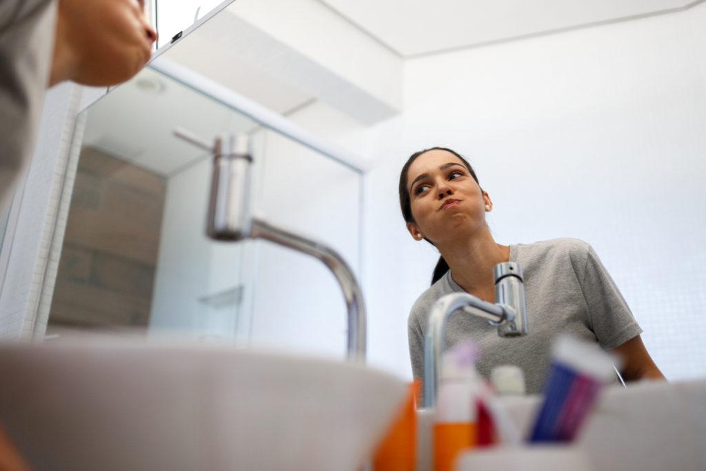 Girl making mouthwash in the morning